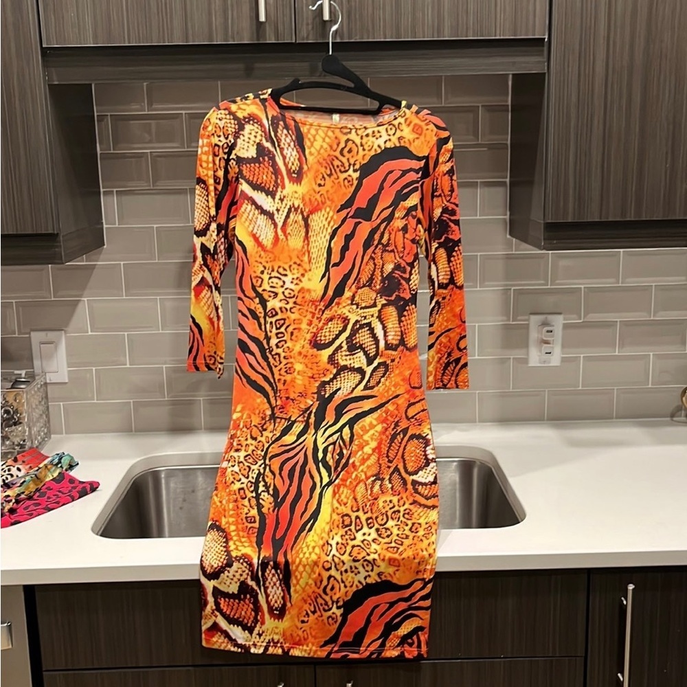 Made by Good time. Very fitted dress. Like new